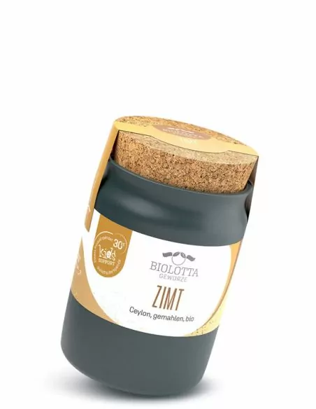 Schwarzes Keramiktöpfchen mit beigegelbem Etikett mit der Aufschrift „ZIMT“.