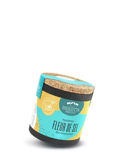 Bio-Pappdose mit türkis-gelbem Etikett mit der Aufschrift „FLEUR DE SEL“.