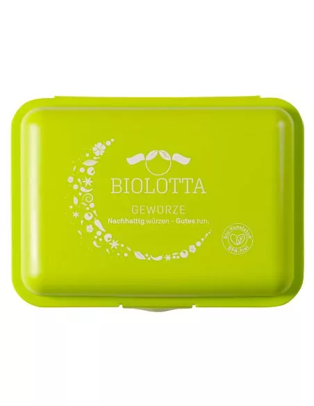 Grüne Brotdose mit weißem Biolotta-Logo und Mondmotiv auf dem Deckel, geschlossen von oben fotografiert.