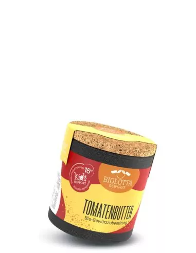 Bio-Pappdose mit rot-gelbem Etikett mit der Aufschrift „TOMATENBUTTER“.