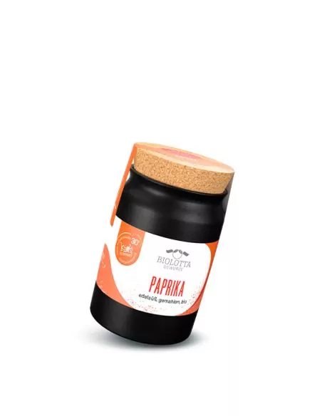 Schwarzes Keramiktöpfchen mit rot-weißem Etikett mit der Aufschrift „PAPRIKA“.
