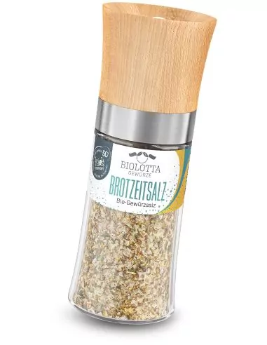 Mühle mit heller Bio-Brotsalzkräutermischung und türkis-grünem Etikett.