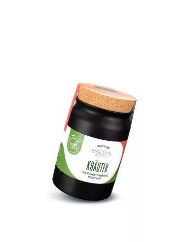 Schwarzes Keramiktöpfchen mit grün-weißem Etikett mit der Aufschrift „KRÄUTER“