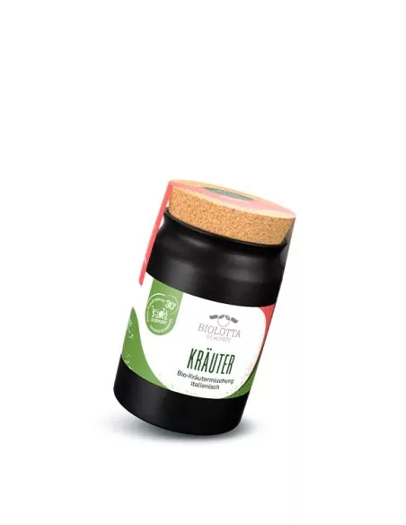 Schwarzes Keramiktöpfchen mit grün-weißem Etikett mit der Aufschrift „KRÄUTER“