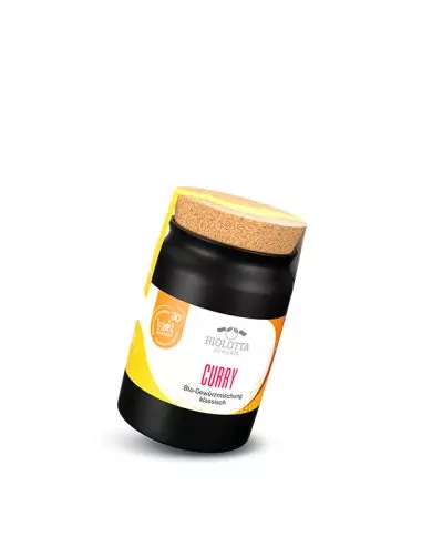 Schwarzes Keramiktöpfchen mit gelb-weißem Etikett mit der Aufschrift „CURRY“