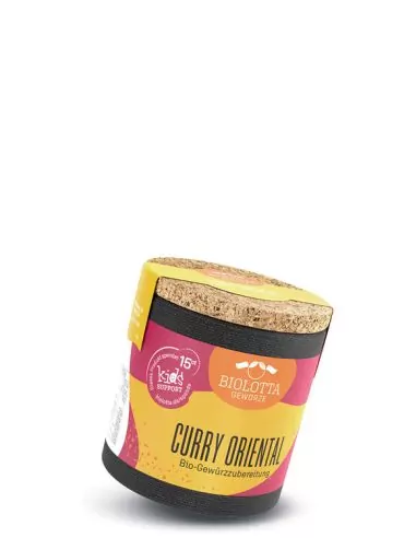 Bio-Pappdose mit gelb-pinkem Etikett mit der Aufschrift „CURRY ORIENTAL“