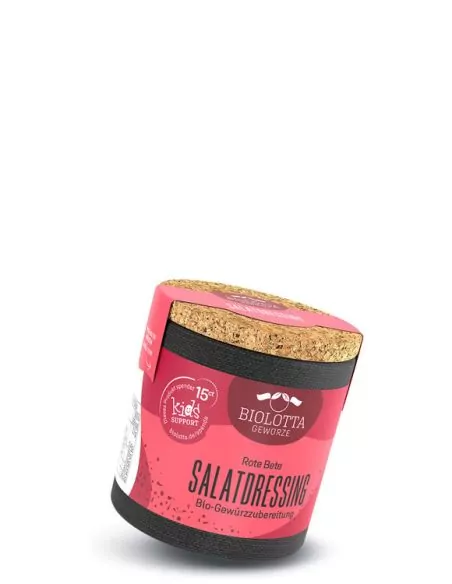 Bio-Pappdose mit pinkfarbenem Etikett mit der Aufschrift „SALATDRESSING“.