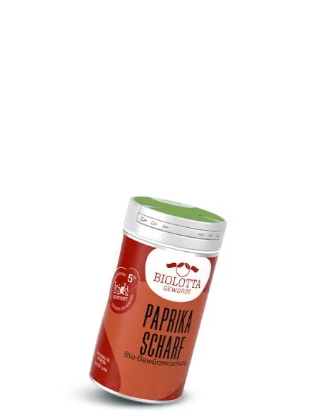 Gewürzstreuer mit rot-orangenem Etikett mit der Aufschrift Paprika scharf, Bio-Gewürzmischung Gewürzstreuer mit rot-orangenem Etikett mit der Aufschrift Paprika scharf, Bio-Gewürzmischung