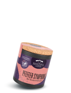Schwarze Pappdose mit violett-rosafarbenem Etikett mit der Aufschrift Pfeffer Symphonie, Bio-Gewürzmischung