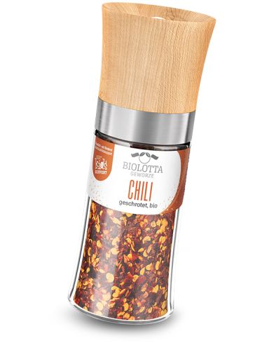 Transparente Gewürzmühle mit rotem Etikett mit der Aufschrift „CHILI grob geschrotet, bio“ und Holzdeckel.