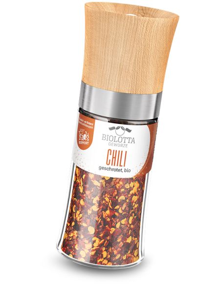 Transparente Gewürzmühle mit rotem Etikett mit der Aufschrift „CHILI grob geschrotet, bio“ und Holzdeckel.