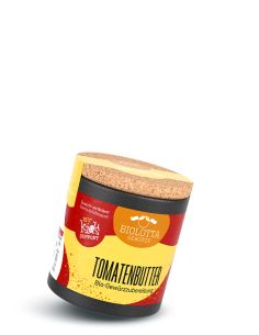 Schwarze Pappdose mit gelb-rotem Etikett mit der Aufschrift Tomatenbutter, Bio-Gewürzzubereitung