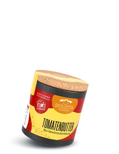 Schwarze Pappdose mit gelb-rotem Etikett mit der Aufschrift Tomatenbutter, Bio-Gewürzzubereitung