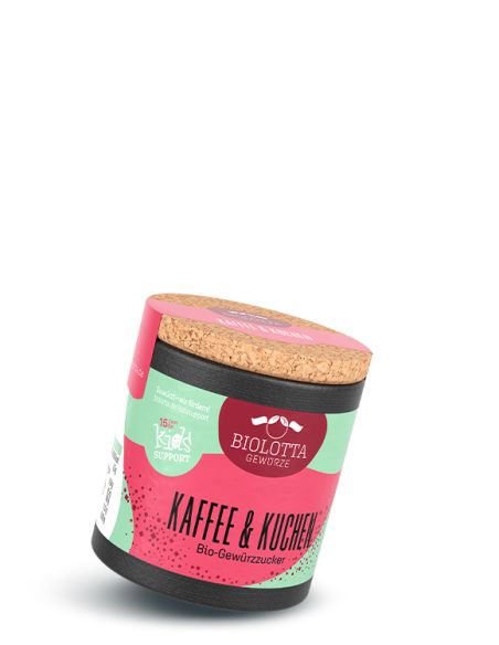 Schwarze Pappdose mit pink-grünem Etikett mit der Aufschrift Kaffe & Kuchen, Bio-Gewürzzucker