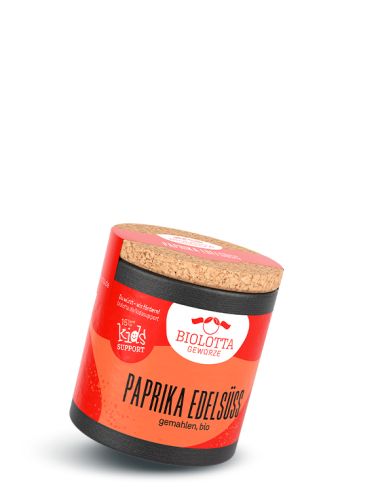 Rote Dose mit Korkdeckel und beiger Beschriftung „Paprika edelsüß“, auf hellem Hintergrund.