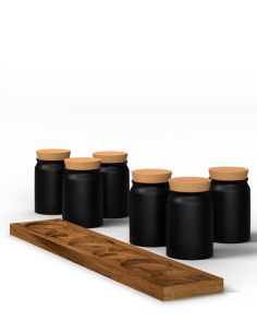 Sechs schwarze Keramiktöpfchen über einem länglichen Holzhalter mit sechs runden Vertiefungen.