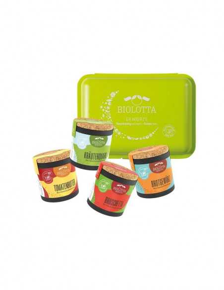 Vier bunte Bio Pappdosen mit Korkdeckel in Grün-, Gelb- und Blautönen stehen vor einer grünen Brotdose mit Biolotta-Logo.