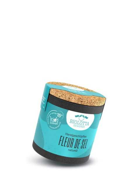 Schwarze Pappdose mit türkisfarbenem Etikett mit der Aufschrift Fleur de Sel, handgeschöpft, naturell