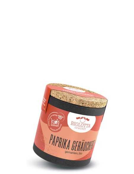 Gelb-rote Gewürzdose mit Korkdeckel, vorne steht „Paprika Geräuchert“ sowie ein Spendenhinweis.